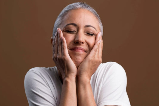 A mature woman with smooth skin after using vitamin A serum
