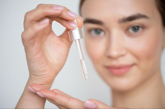A woman taking out the serum droplets on her hand