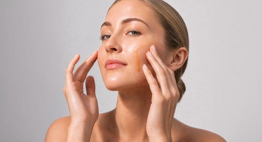 A middle-aged woman applying DRSQ Active A serum on her face