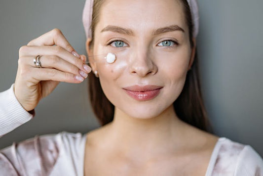 An Australian woman is applying a salicylic acid treatment on her face