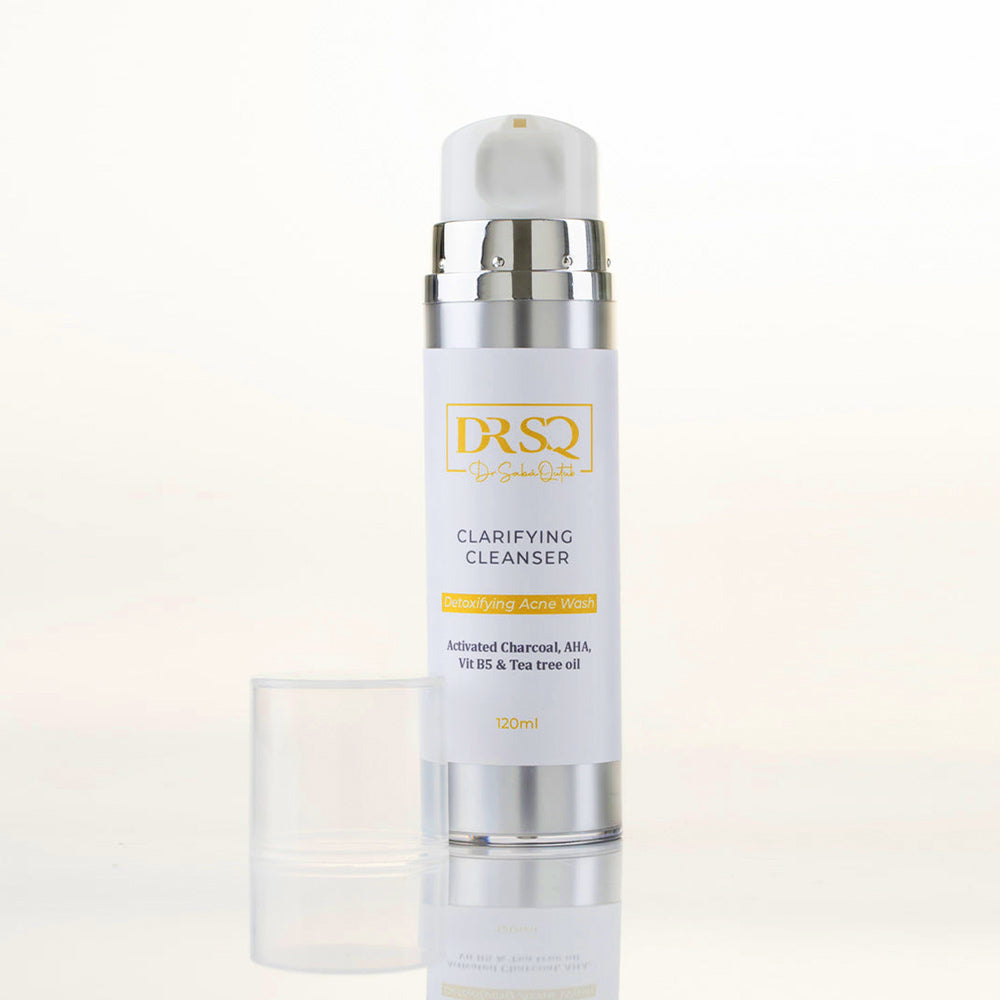 DRSQ Clarifying Cleanser kept open on a plain surface