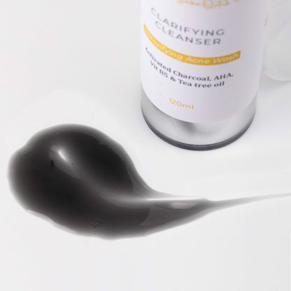 Close-up of Clarifying Cleanser bottle with visible product texture