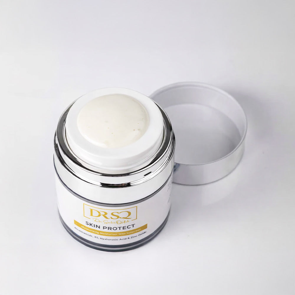 Skin Protect moisturiser kept open on a white surface with some product popping out