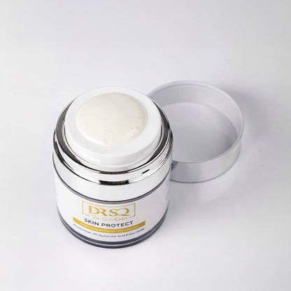 Skin Protect moisturiser kept open on a white surface with some product popping out